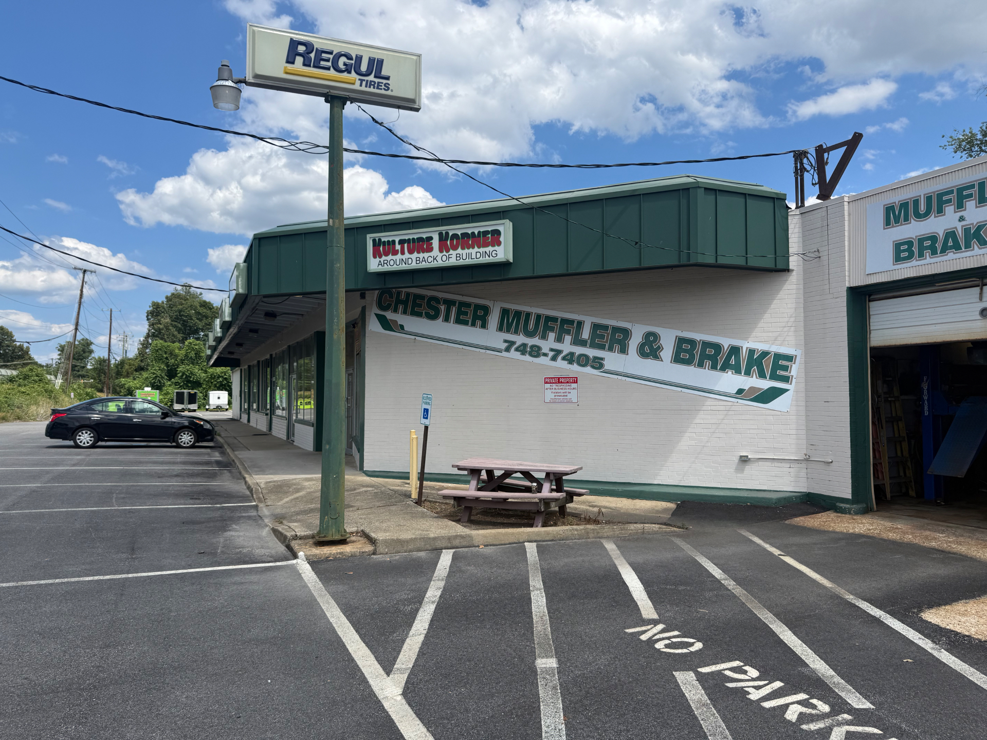 Front and side angle view of Chester Muffler & Brake building